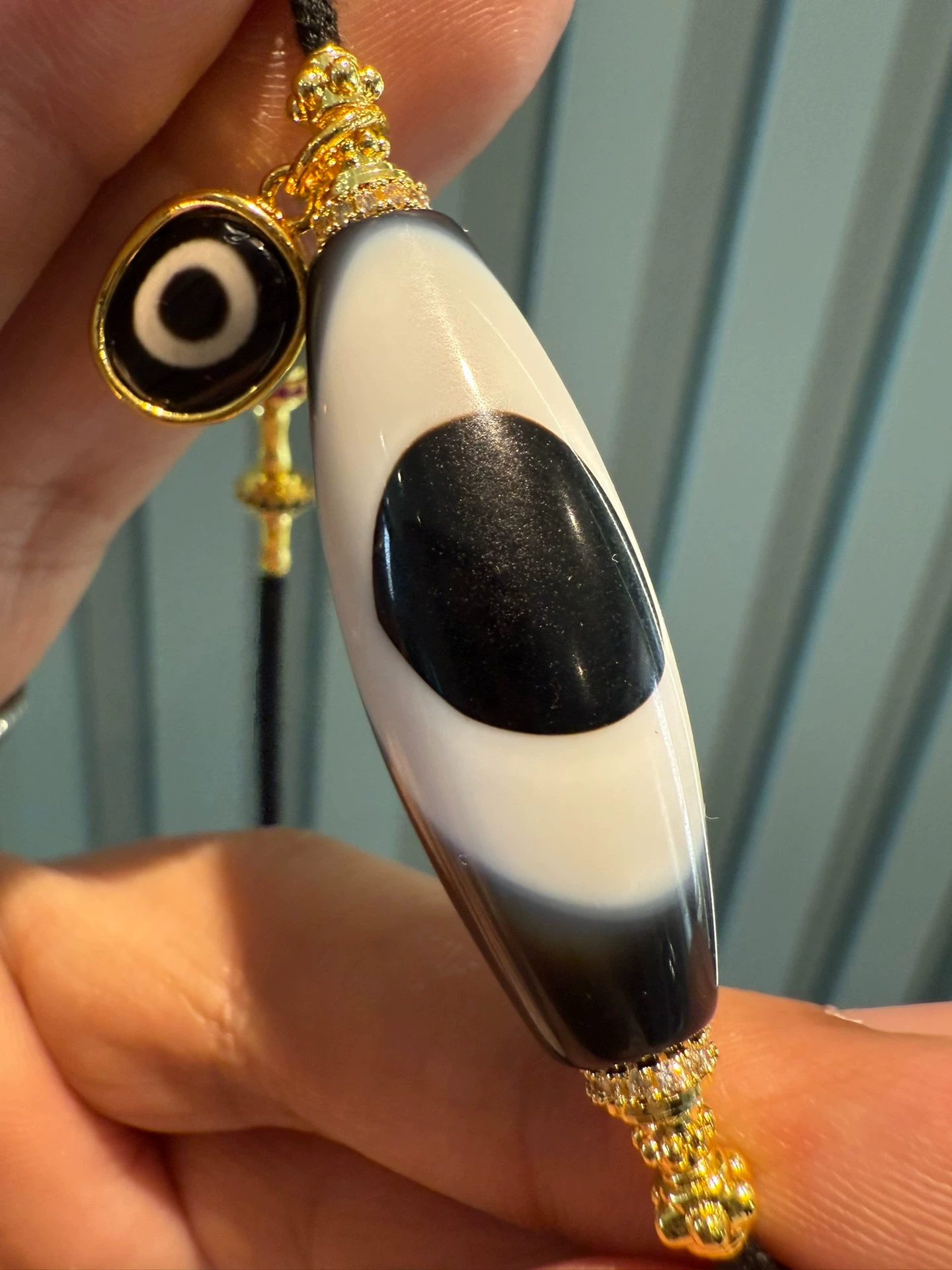 Black and Gold Coconut Palm Kernel 8mm (approx. 0.31 inches) Modified Single - loop Multi - gemstone Bracelet (Incorporating Ultra - rare Blue - infiltrated Lava Agate, Layered Agate, and Silk - like Agate) and Black - and - White Dzi Bead Necklace