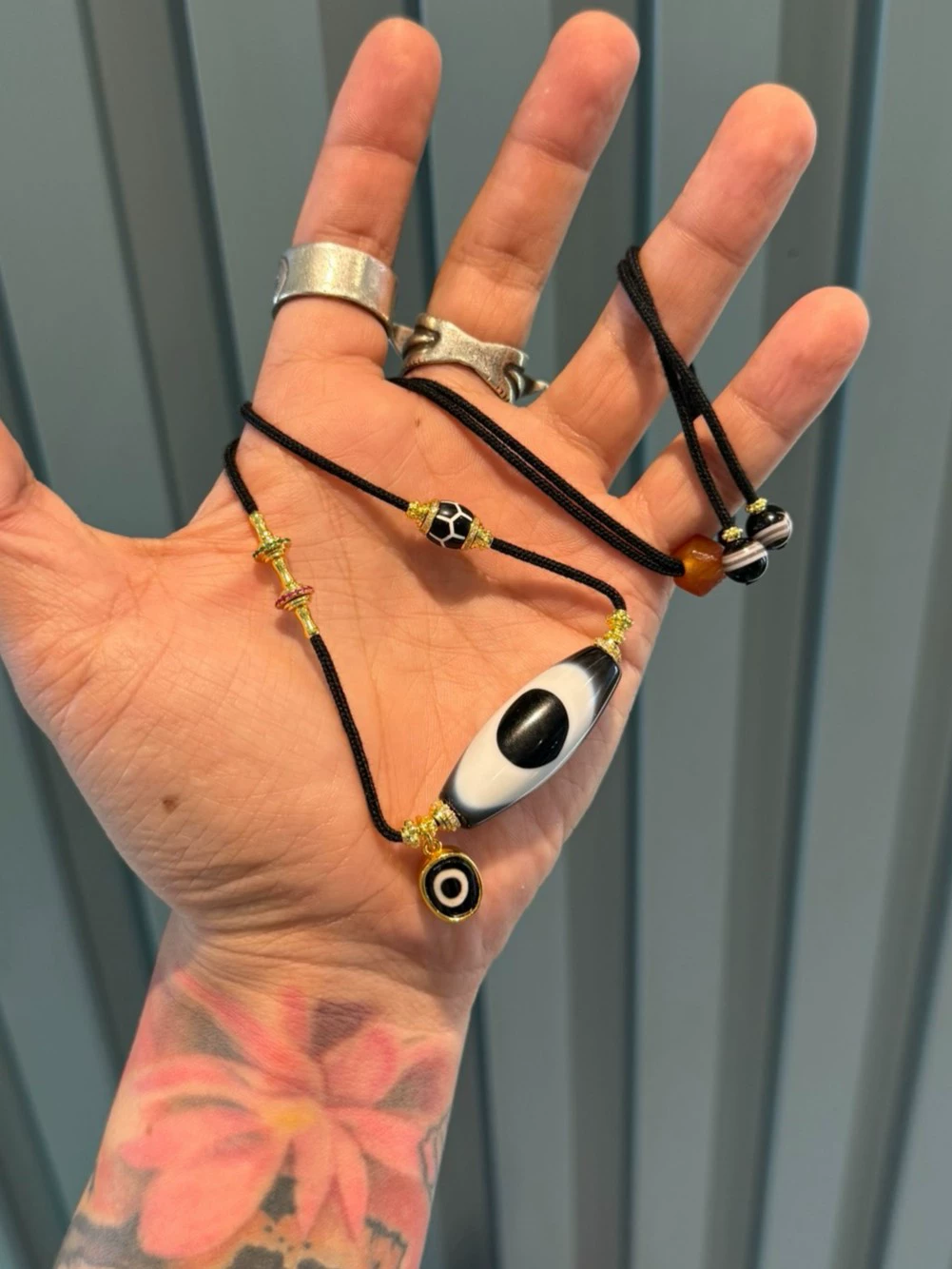 Black and Gold Coconut Palm Kernel 8mm (approx. 0.31 inches) Modified Single - loop Multi - gemstone Bracelet (Incorporating Ultra - rare Blue - infiltrated Lava Agate, Layered Agate, and Silk - like Agate) and Black - and - White Dzi Bead Necklace
