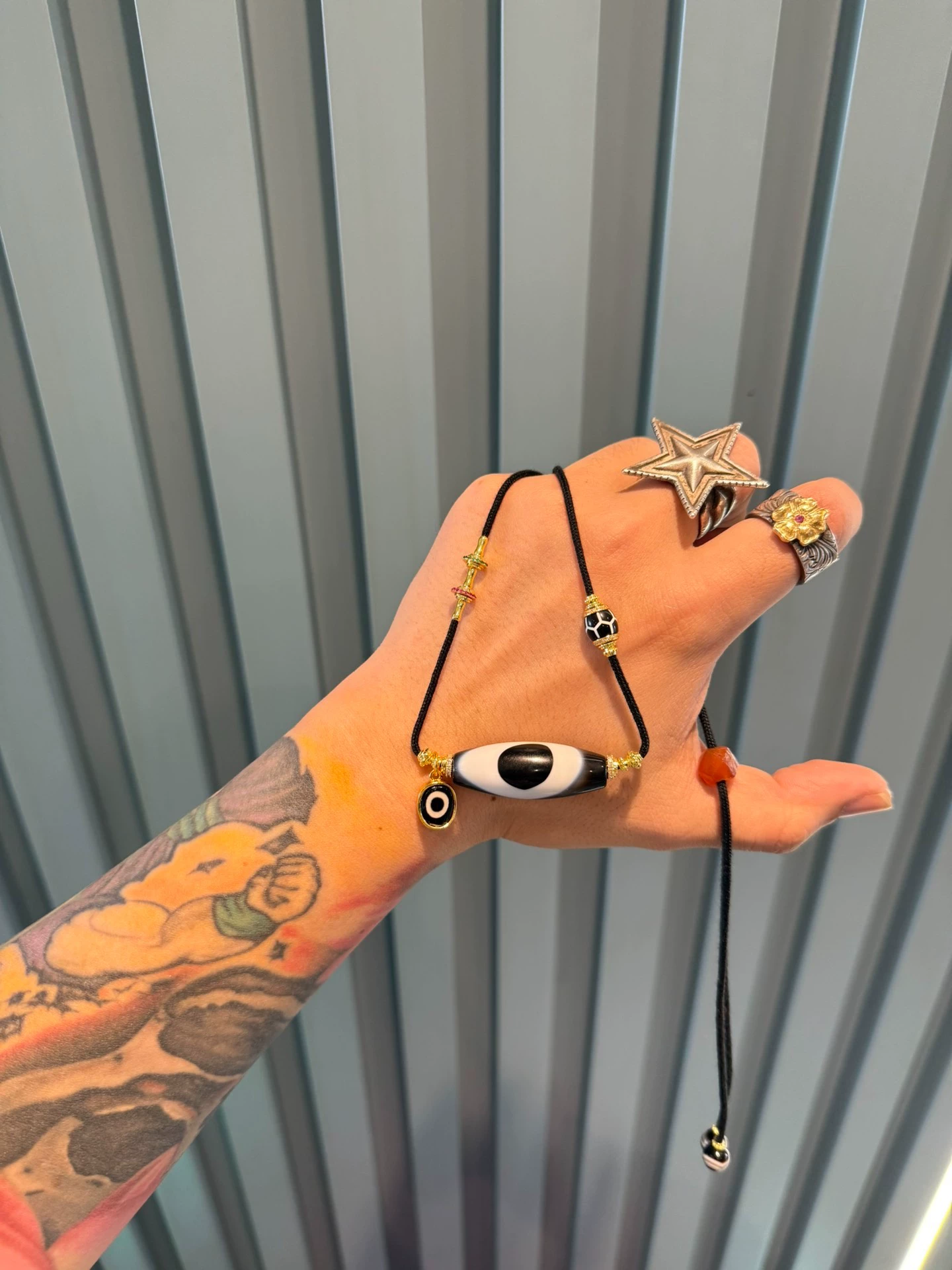 Black and Gold Coconut Palm Kernel 8mm (approx. 0.31 inches) Modified Single - loop Multi - gemstone Bracelet (Incorporating Ultra - rare Blue - infiltrated Lava Agate, Layered Agate, and Silk - like Agate) and Black - and - White Dzi Bead Necklace